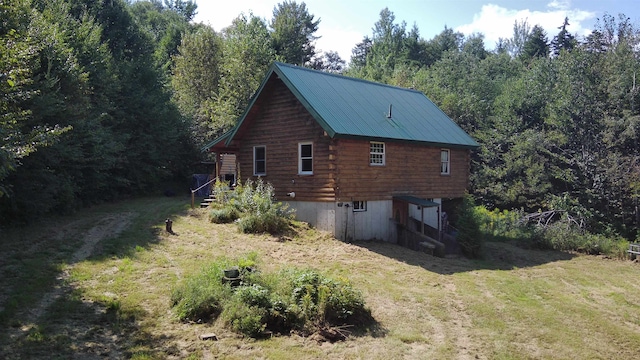 view of home's exterior with a lawn