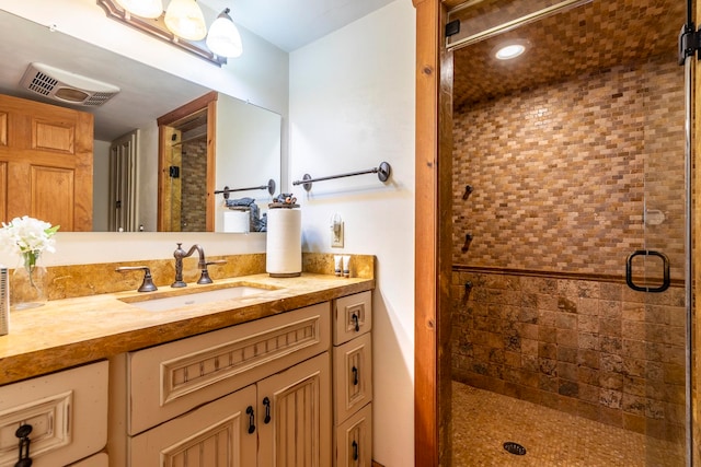 bathroom featuring vanity and walk in shower