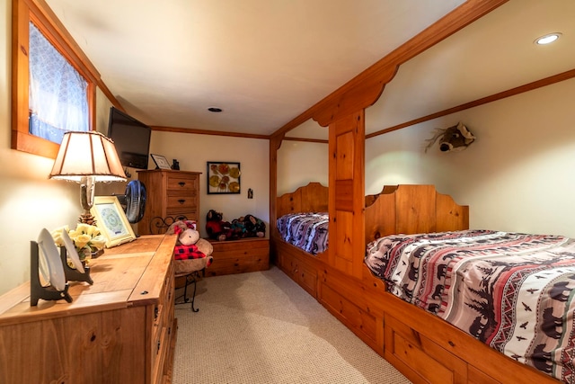 bedroom with crown molding and light colored carpet