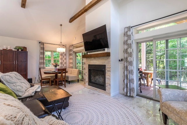 living room with a towering ceiling and beam ceiling