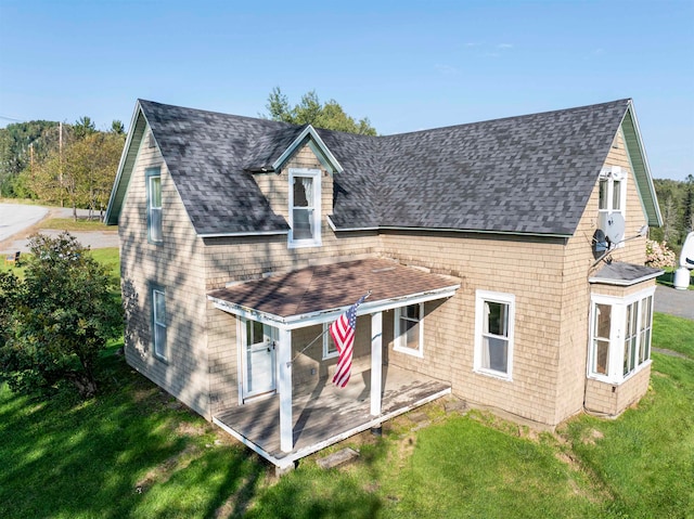 back of house with a yard