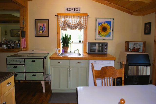 kitchen with dishwasher, sink, dark hardwood / wood-style floors, vaulted ceiling, and white cabinets