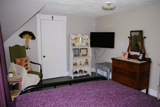 bedroom with a closet and a textured ceiling