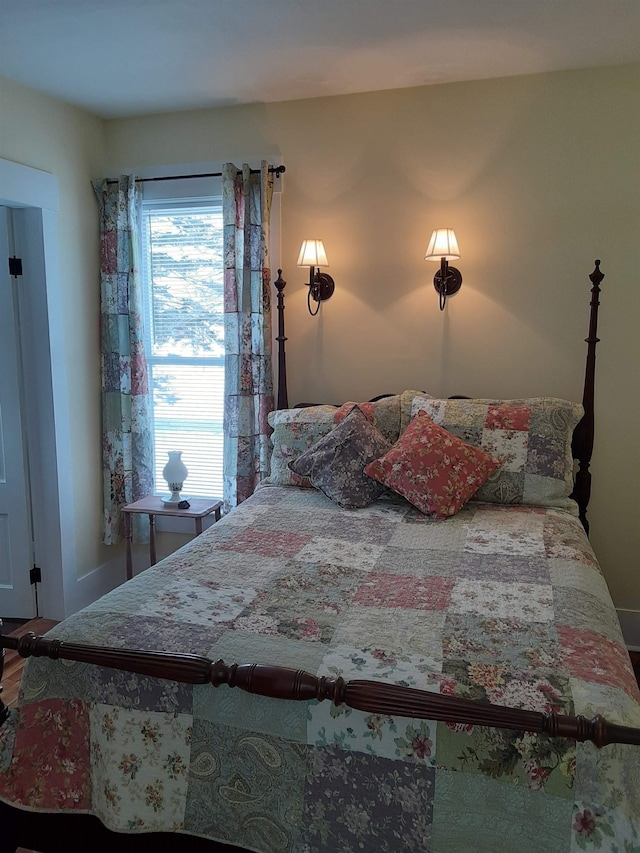 bedroom with hardwood / wood-style floors