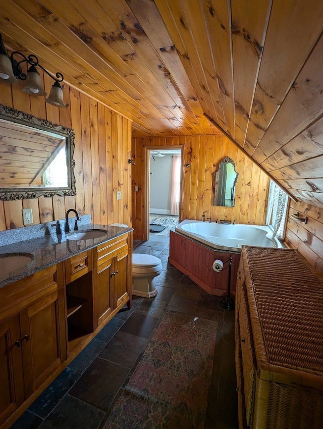 interior space featuring wood ceiling, toilet, a bathing tub, and wooden walls