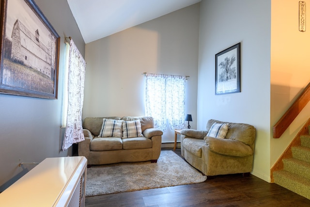 living room featuring dark wood-type flooring, stairs, lofted ceiling, and a baseboard radiator