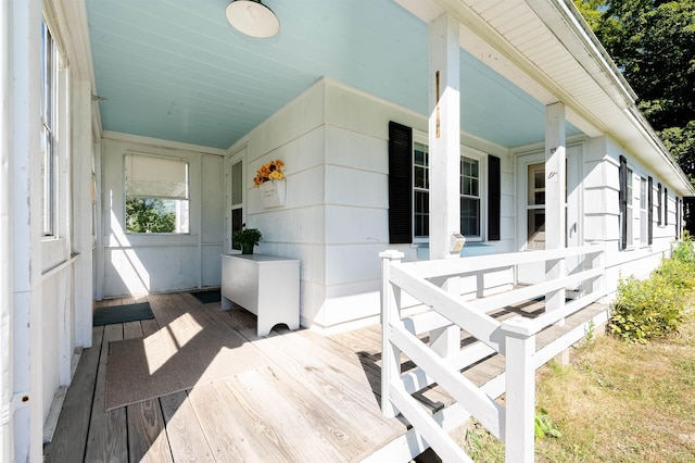 wooden terrace featuring covered porch