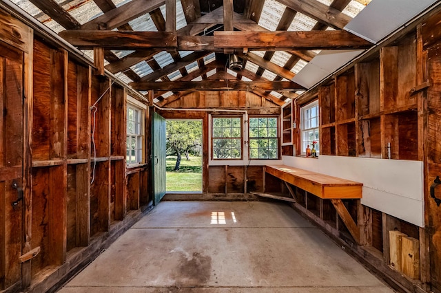 miscellaneous room featuring lofted ceiling and concrete floors