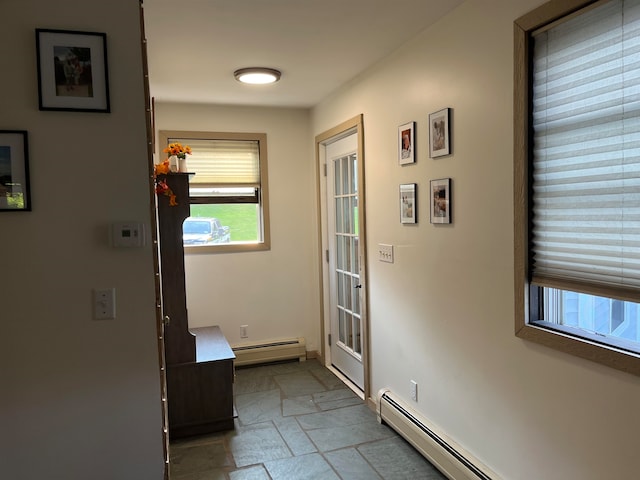 entryway featuring stone tile flooring and baseboard heating