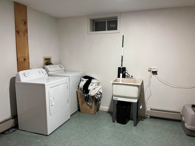 laundry area featuring washer and clothes dryer, a baseboard radiator, a baseboard heating unit, a sink, and laundry area