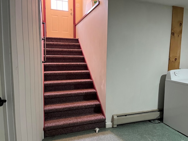 staircase with a baseboard radiator and washer / dryer