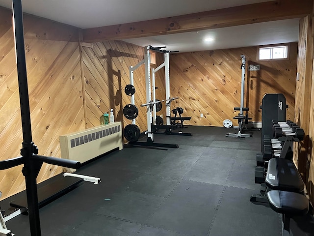 workout area featuring wooden walls