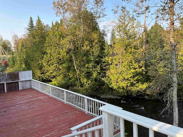 wooden terrace with a water view