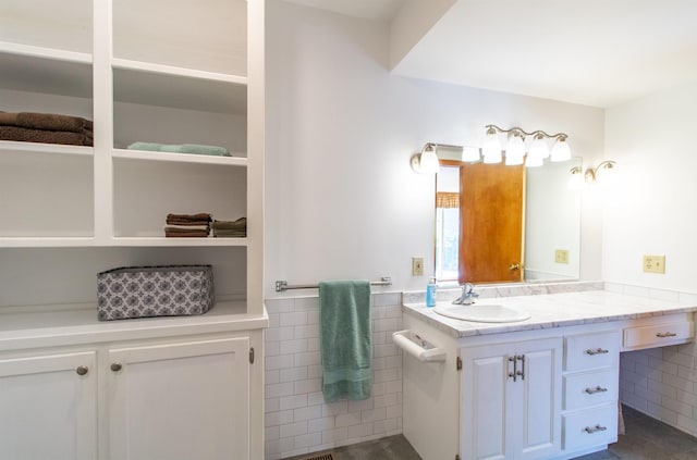 6694 Vt Route 100, Troy, VT 05859 - bathroom with vanity, tile walls, and wainscoting