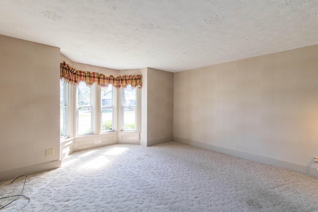 6694 Vt Route 100, Troy, VT 05859 - carpeted empty room featuring a textured ceiling and baseboards