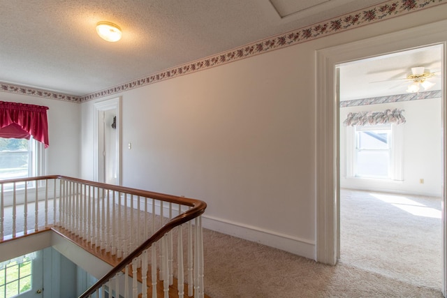 6694 Vt Route 100, Troy, VT 05859 - hall featuring baseboards, carpet flooring, an upstairs landing, and a textured ceiling