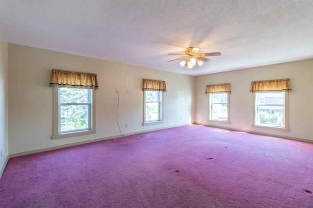 unfurnished room with a textured ceiling, ceiling fan, and carpet flooring