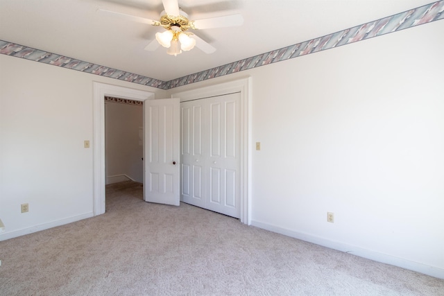6694 Vt Route 100, Troy, VT 05859 - unfurnished bedroom featuring a closet, baseboards, and carpet