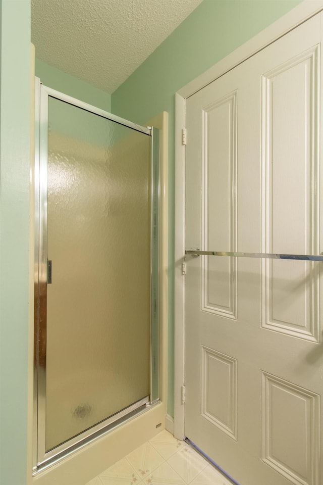 6694 Vt Route 100, Troy, VT 05859 - bathroom with a stall shower and a textured ceiling