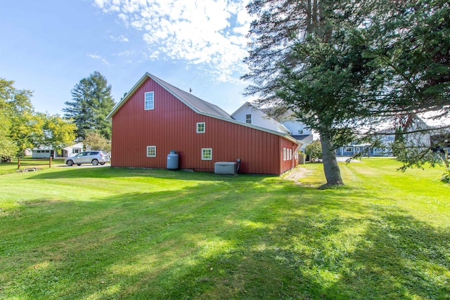 6694 Vt Route 100, Troy, VT 05859 - view of side of property with a yard, a pole building, and an outdoor structure