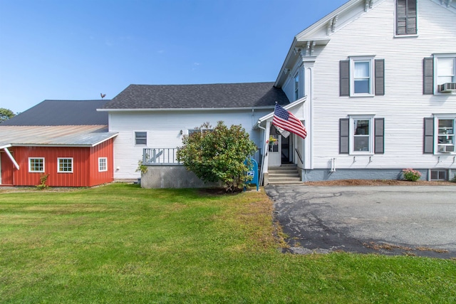 view of home's exterior featuring a yard