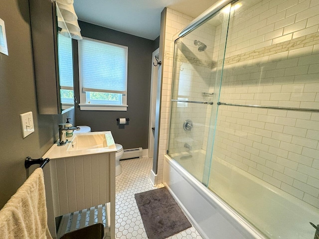 full bathroom featuring bath / shower combo with glass door, vanity, a baseboard radiator, and toilet