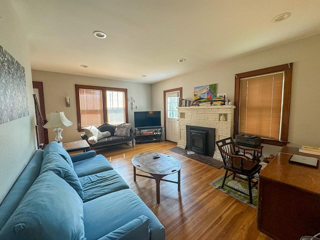 living room featuring hardwood / wood-style floors and a fireplace