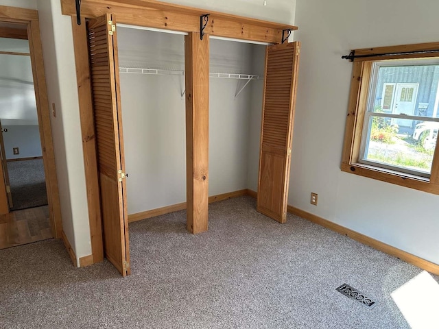 unfurnished bedroom with carpet floors