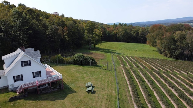 birds eye view of property with a rural view