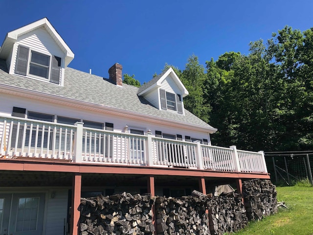 back of house with a wooden deck