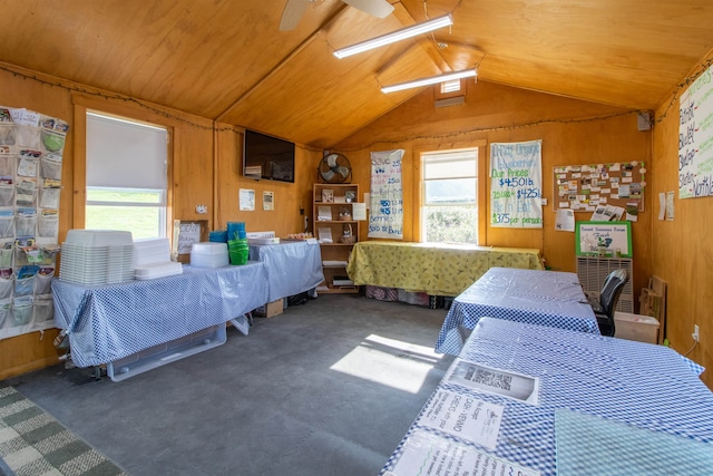 carpeted bedroom featuring lofted ceiling, ceiling fan, wooden walls, and wood ceiling