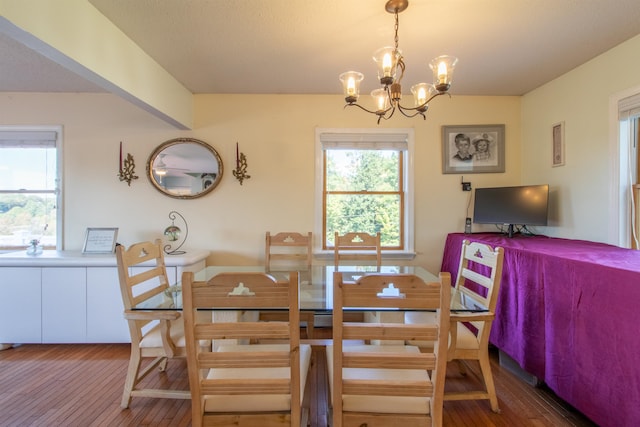 dining space featuring a chandelier and hardwood / wood-style floors