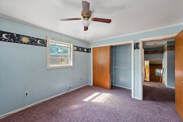 unfurnished bedroom with a closet, ceiling fan, carpet, and ornamental molding