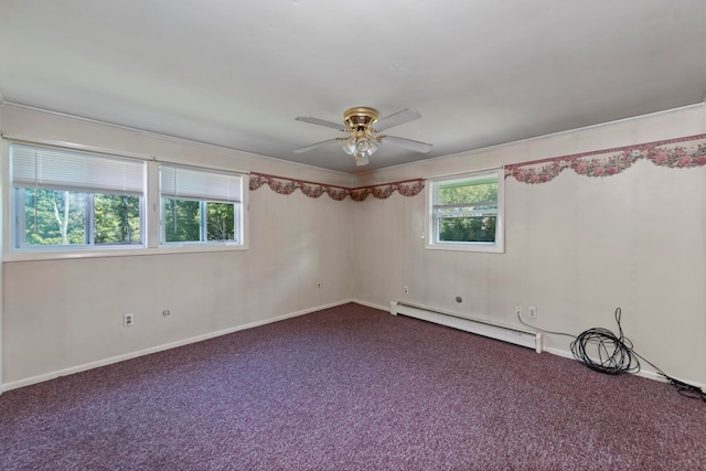 carpeted empty room with a baseboard radiator, plenty of natural light, and ceiling fan