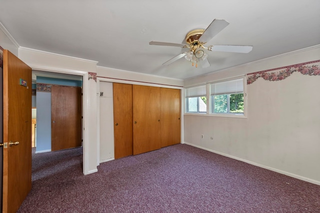 unfurnished bedroom with crown molding, a closet, ceiling fan, and carpet floors