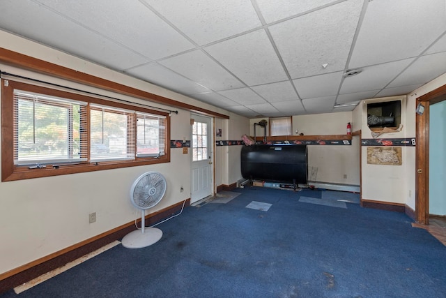 workout area featuring a drop ceiling and carpet floors