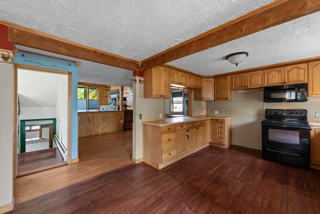 kitchen featuring dark wood-type flooring, black appliances, and a textured ceiling