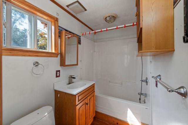 full bathroom with toilet, ornamental molding, vanity, a textured ceiling, and washtub / shower combination