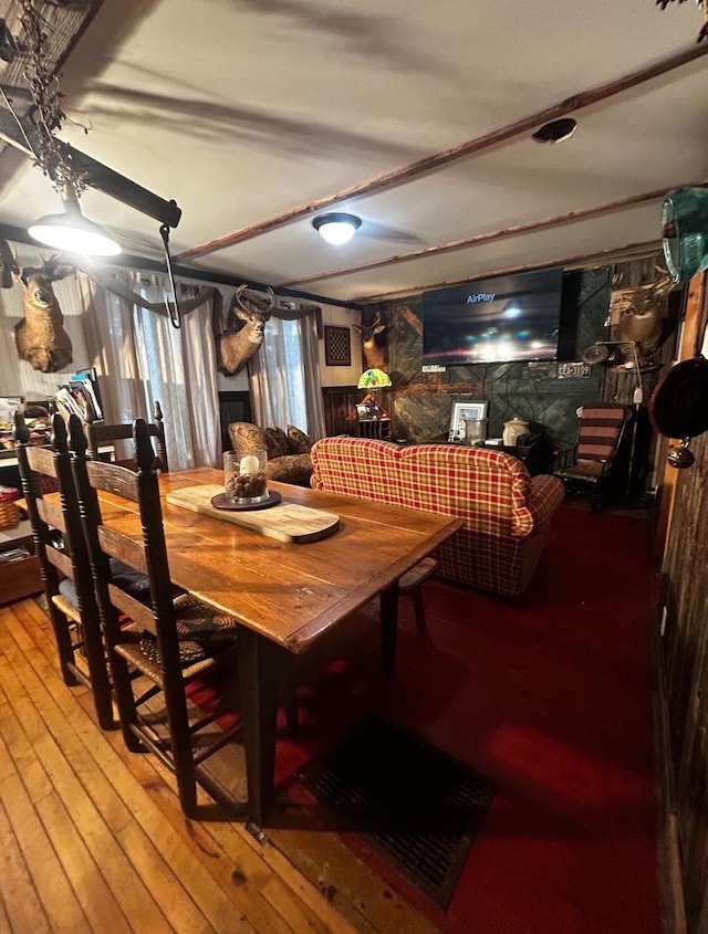 dining room with wood-type flooring