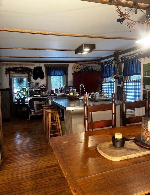 dining area with dark hardwood / wood-style flooring