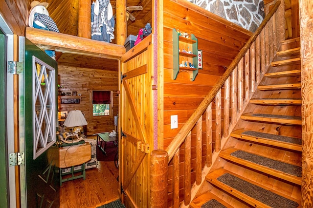 359 Gold Coast Dr, Wakefield, NH 03830 - stairs with wooden walls and wood finished floors