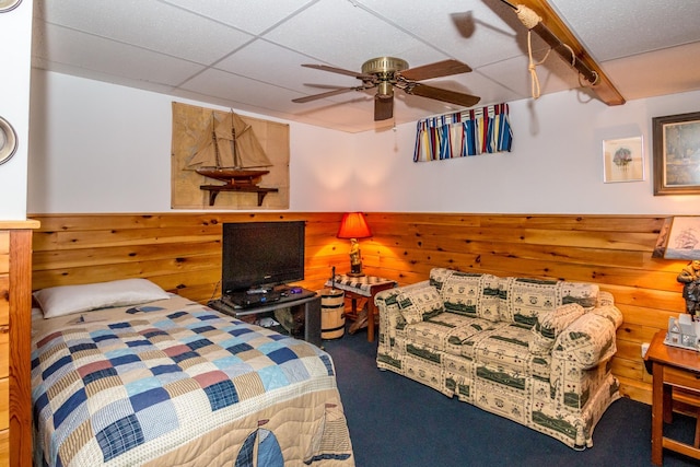 359 Gold Coast Dr, Wakefield, NH 03830 - bedroom featuring carpet, wooden walls, a drop ceiling, and a ceiling fan