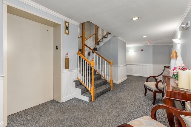 interior space featuring crown molding and carpet flooring