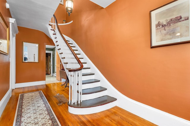 stairway with wood-type flooring