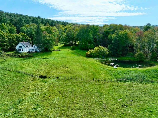 aerial view with a rural view and a water view