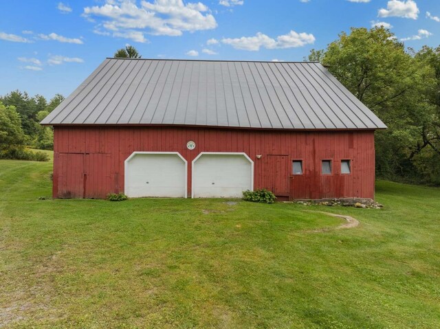 garage featuring a yard