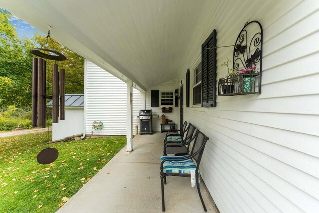 view of patio / terrace with area for grilling and a porch