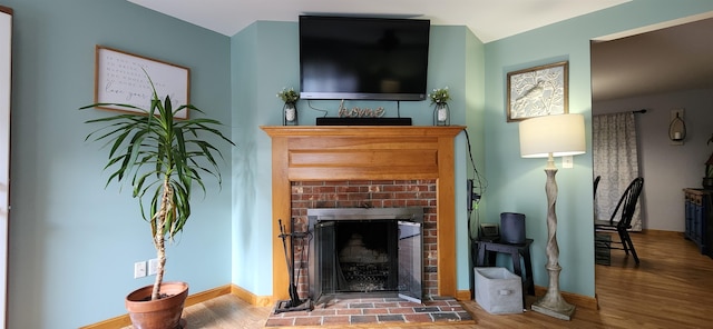 living room featuring a fireplace and hardwood / wood-style flooring