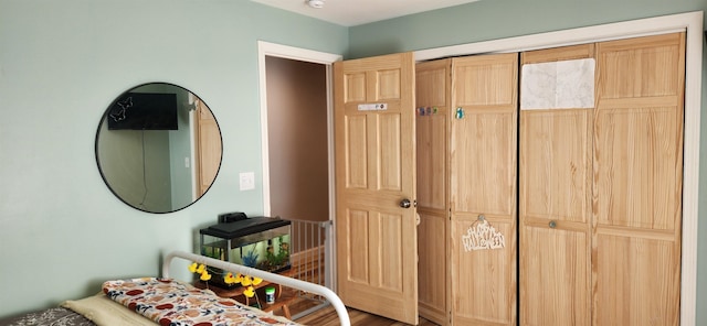 bedroom with hardwood / wood-style floors