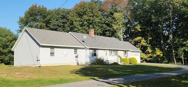 cape cod home with a front yard